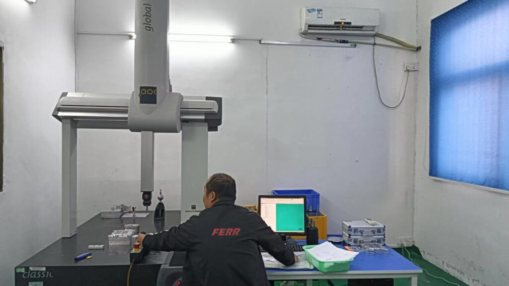 FERR employee doing a cmm test.